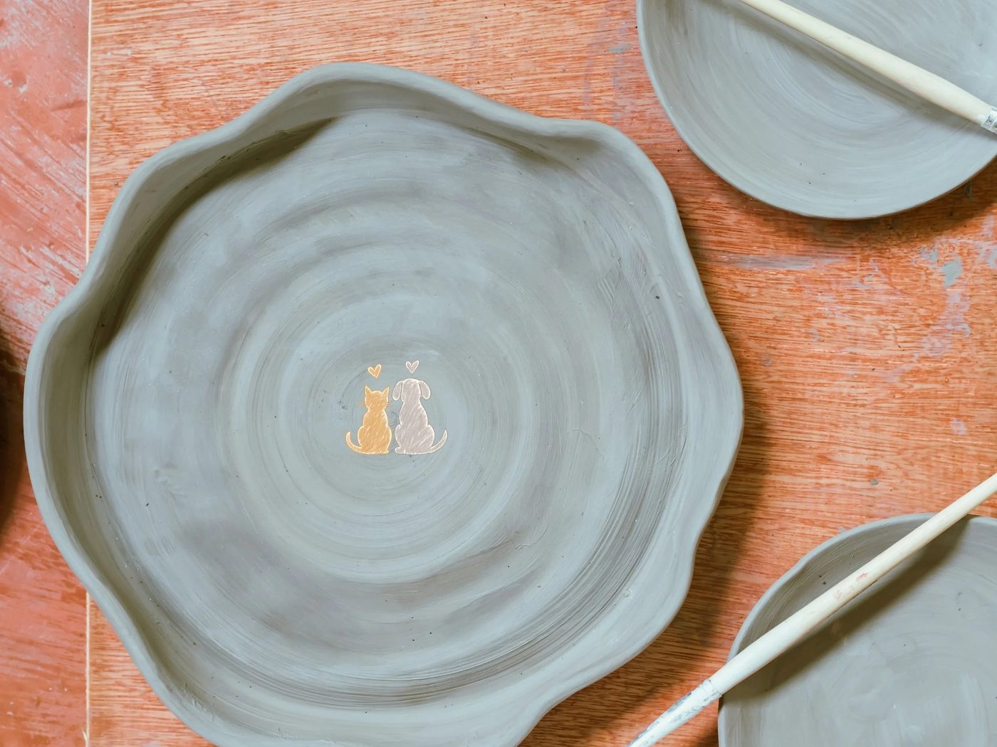 Handmade ceramic pet dish in progress at COVET Ceramics Napa Valley
